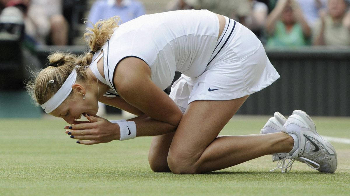 Petra Kvitova In Action During A Professional Tennis Match Wallpaper