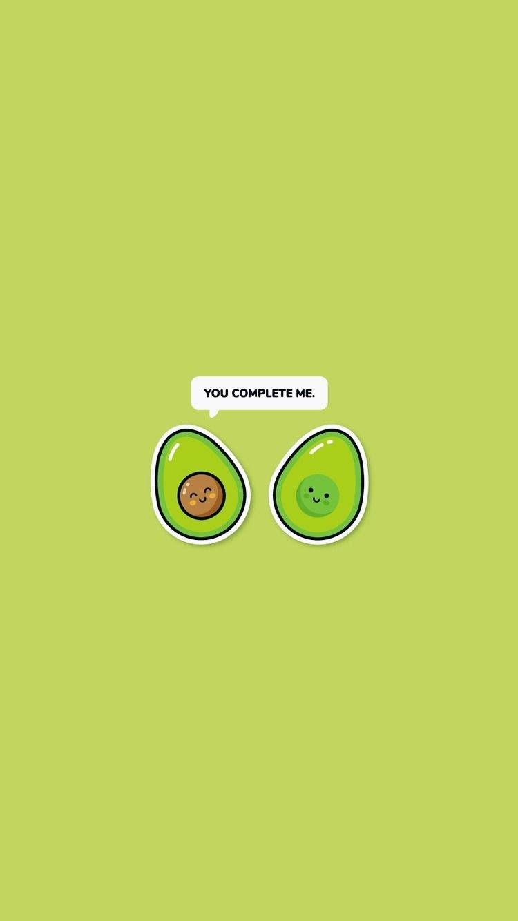 Playful Banter Between Two Adorable Avocados Wallpaper