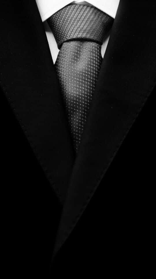 Polka Dots Necktie With A Black And White Men Suit Wallpaper