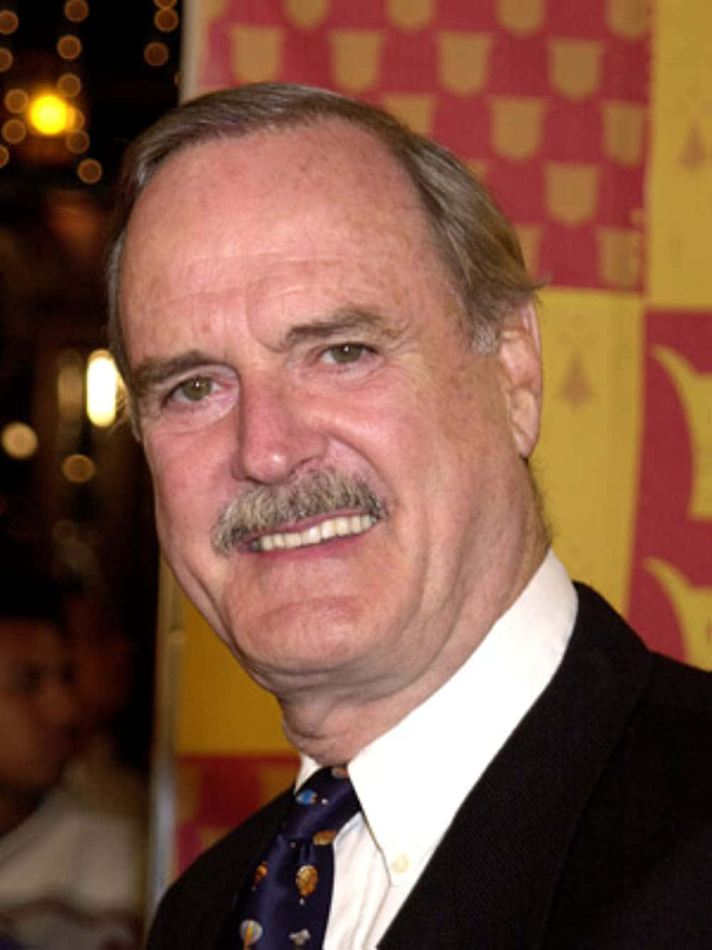 Portrait Of John Cleese, Iconic British Comedian. Wallpaper