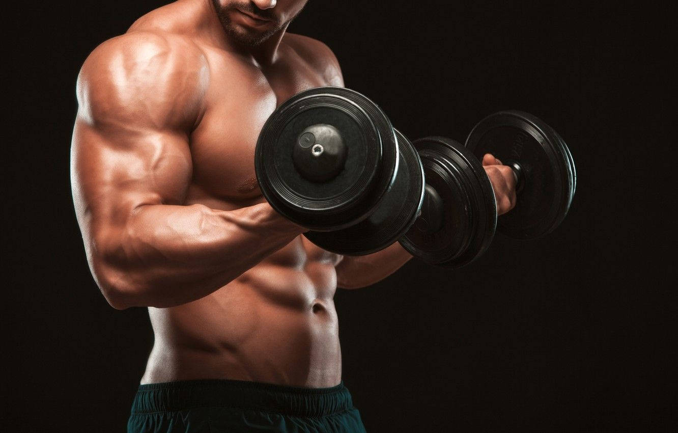 Power In Every Curl: Muscular Man Flexing Biceps Wallpaper