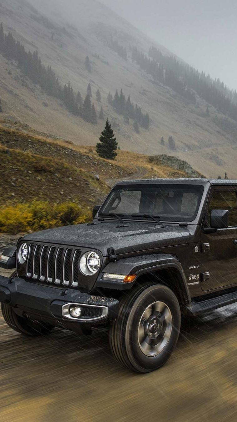 Powerful Black Jeep Conquering The Rain Wallpaper