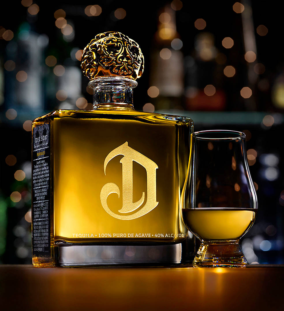 Premium Deleon Gold Tequila - A Toast To The High Life Wallpaper