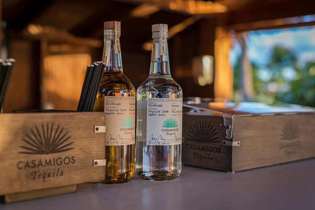 Premium Experience With Casamigos Tequila Reposado And Blanco Liquor Bottles Wallpaper