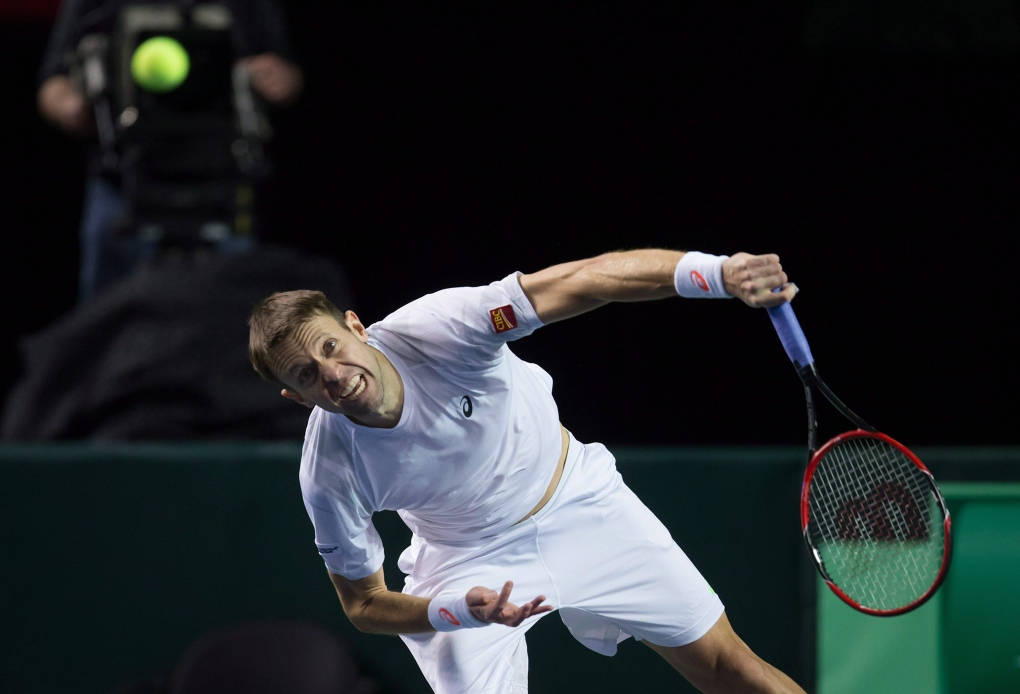 Pro Tennis Player Daniel Nestor In Rigorous Action Wallpaper