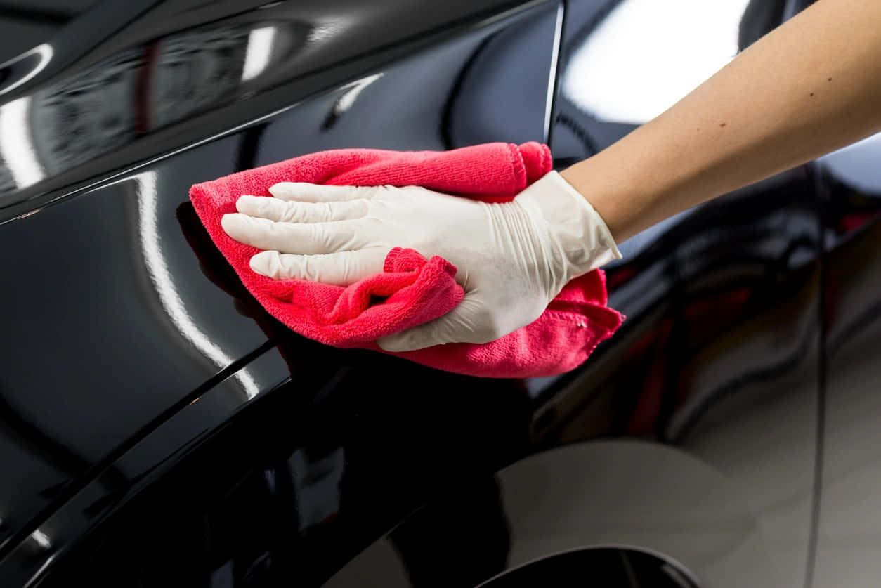 Professional Car Detailing In Action Wallpaper