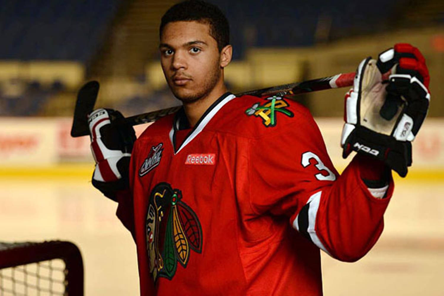 Professional Hockey Player Seth Jones Holding Hockey Stick Wallpaper