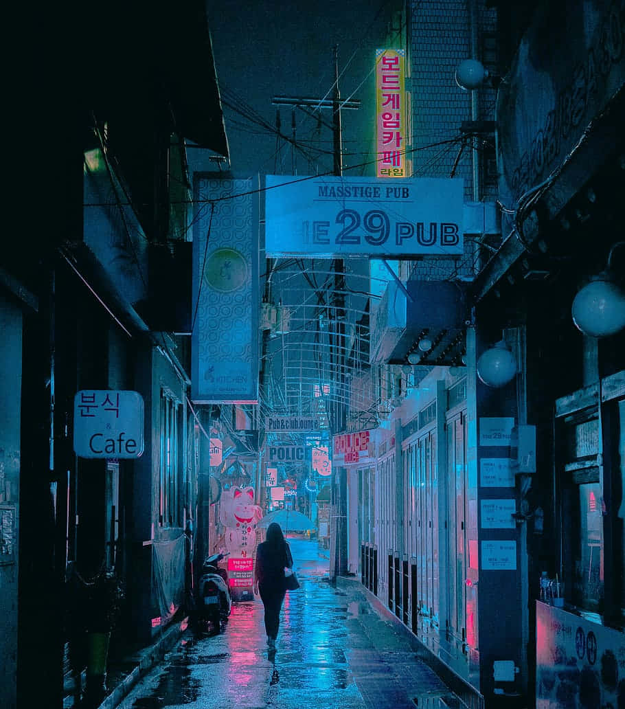 Random Person Walking Through A Dim Street Wallpaper