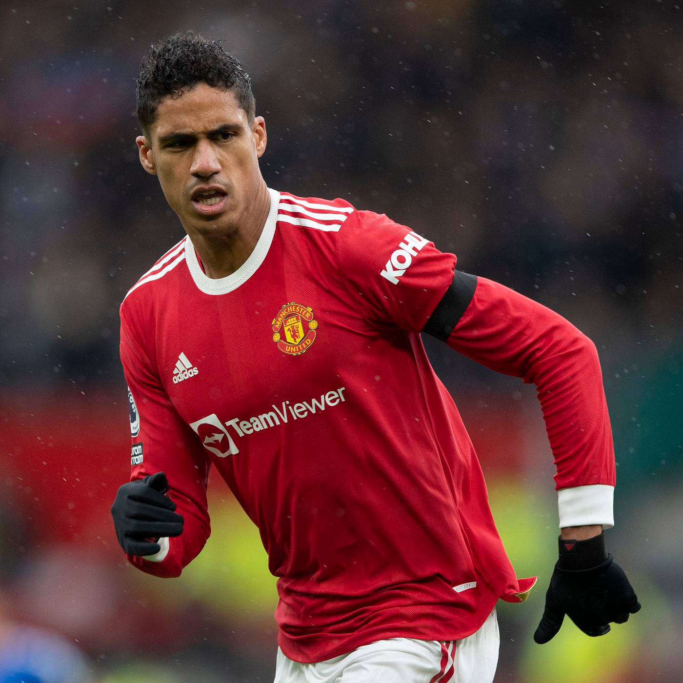 Raphael Varane Black Gloves Red Wallpaper