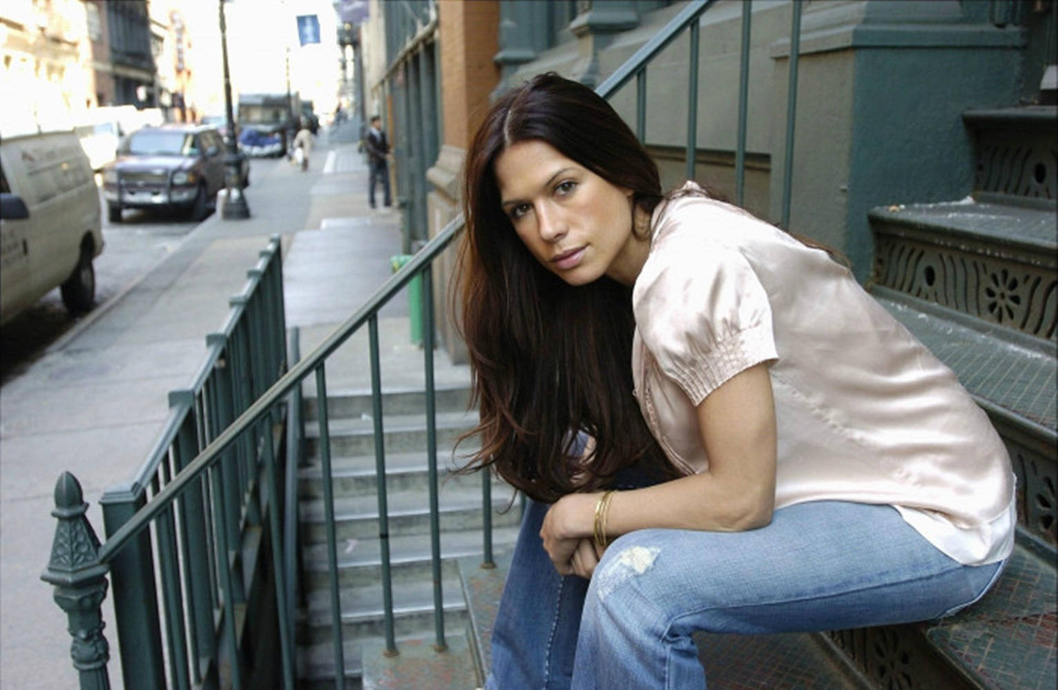 Rhona Mitra Striking A Pose In Stylish Denim Jeans. Wallpaper