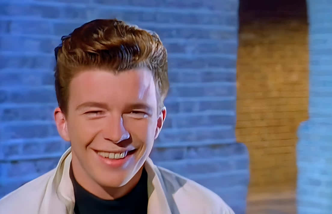 Rick Astley Performing At A Concert Wallpaper