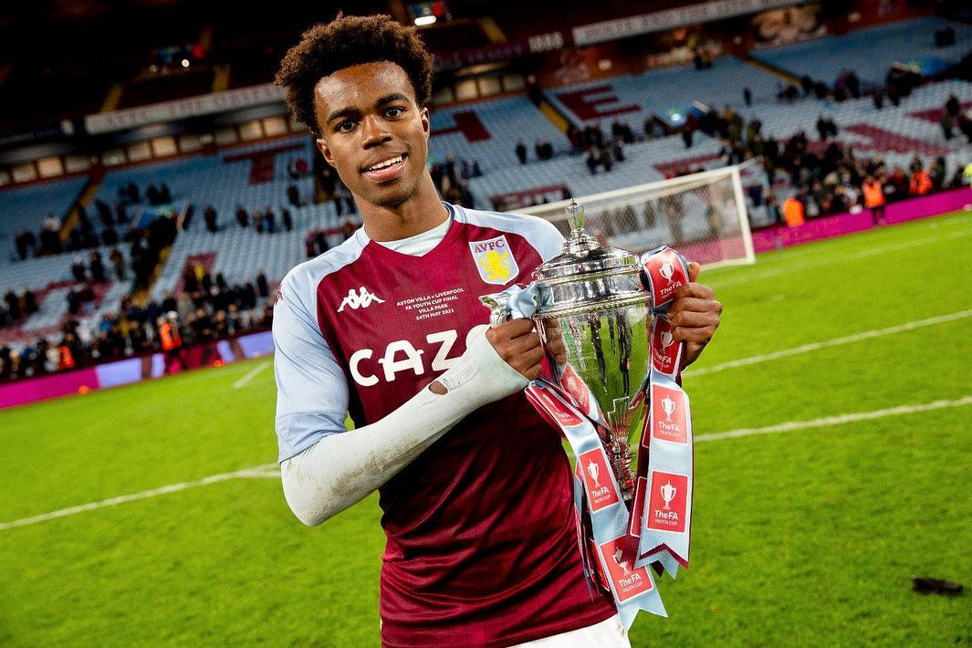 Rising Soccer Star, Carney Chukwuemeka Holding A Trophy Triumphantly Wallpaper