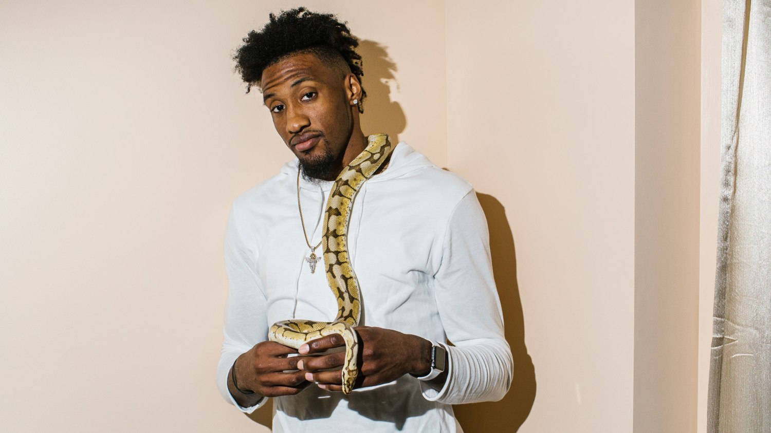 Robert Covington Carries Snake For Photoshoot Wallpaper