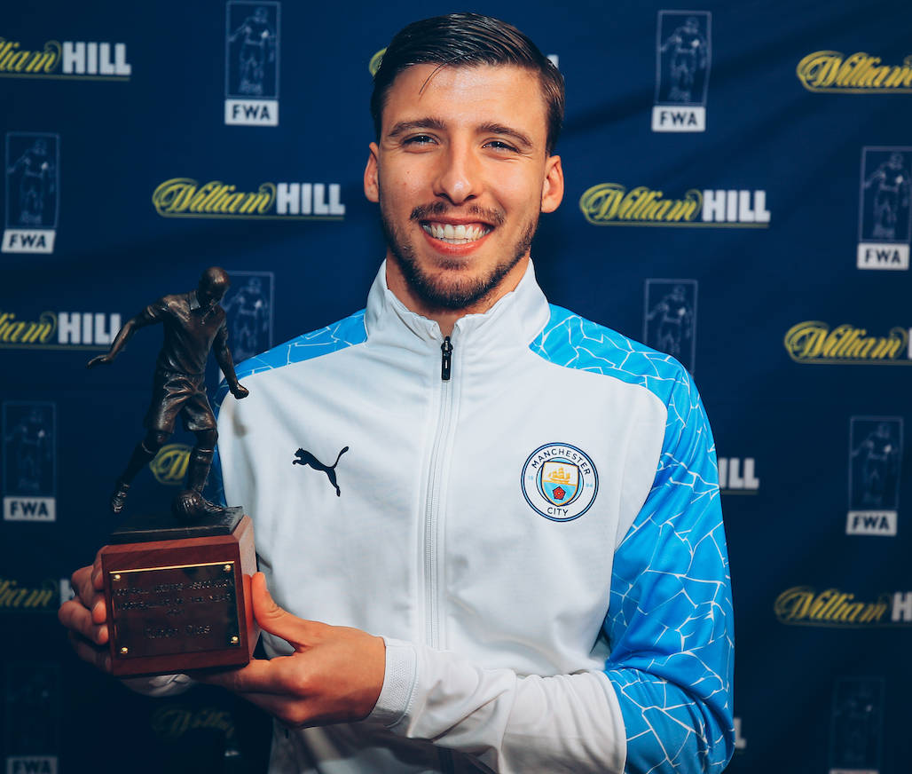 Ruben Dias With A Trophy Wallpaper