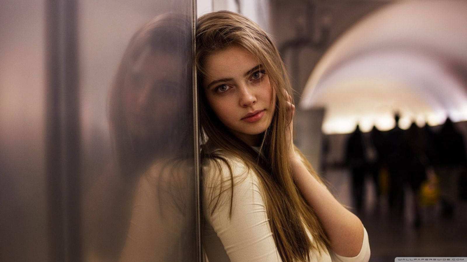 Russian Schoolgirl Learning While Leaning Against A Steel Wall Wallpaper