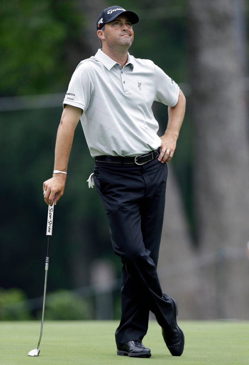 Ryan Palmer Looking Up Leaning On Golf Club Wallpaper