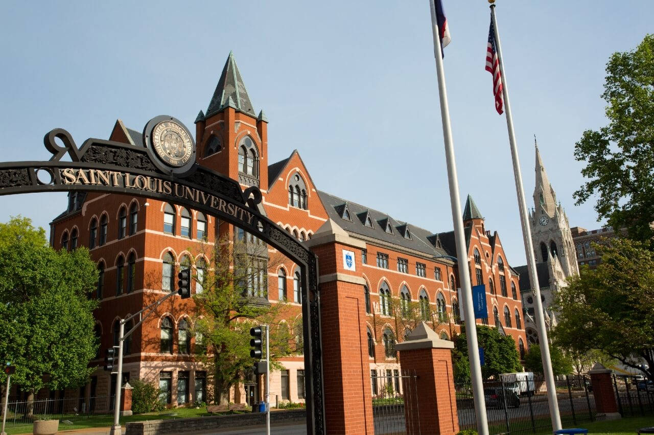 Saint Louis University Arch And Flag Wallpaper