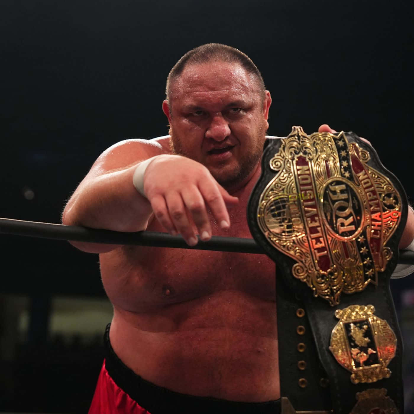 Samoa Joe Proudly Displaying The Roh Championship Belt Wallpaper