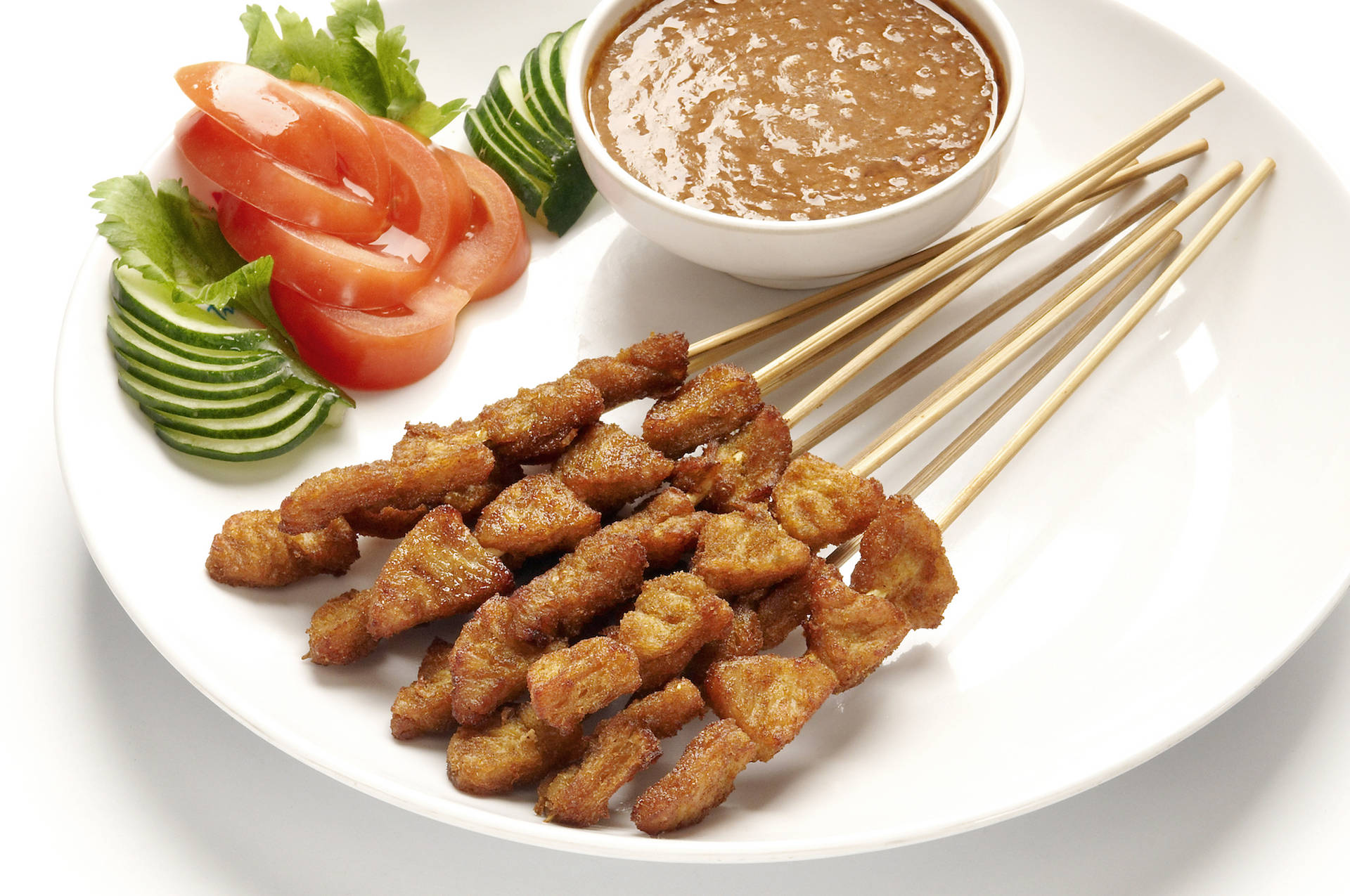 Savory Chicken Satay On A Tranquil White Plate Wallpaper