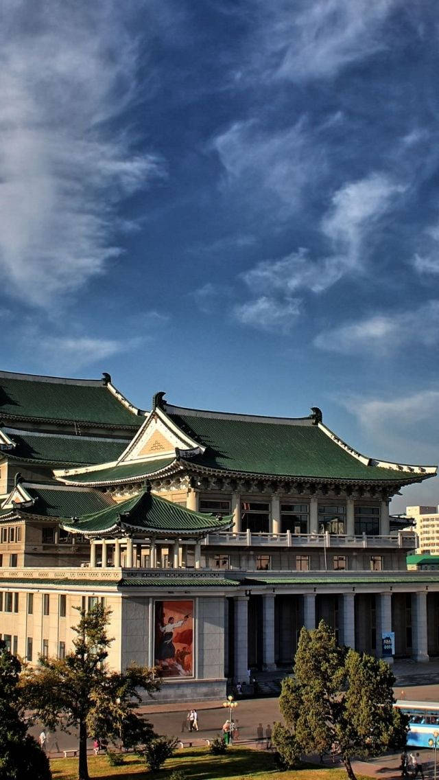 Scenic View Of Pyongyang Grand Theatre At Dusk Wallpaper