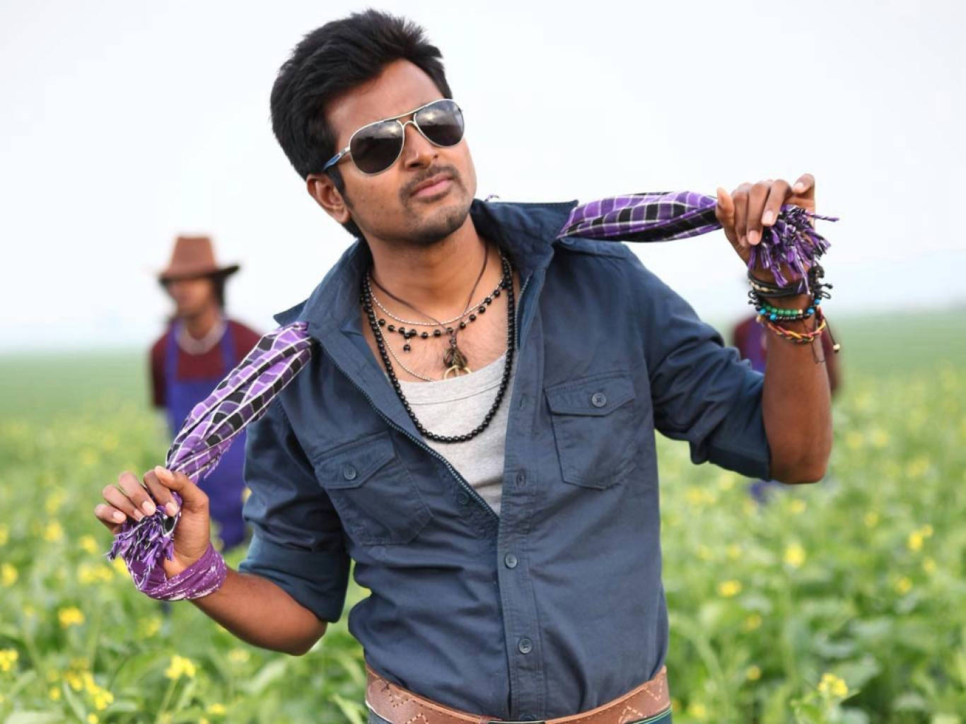 Sivakarthikeyan Standing In A Farm Field Wallpaper