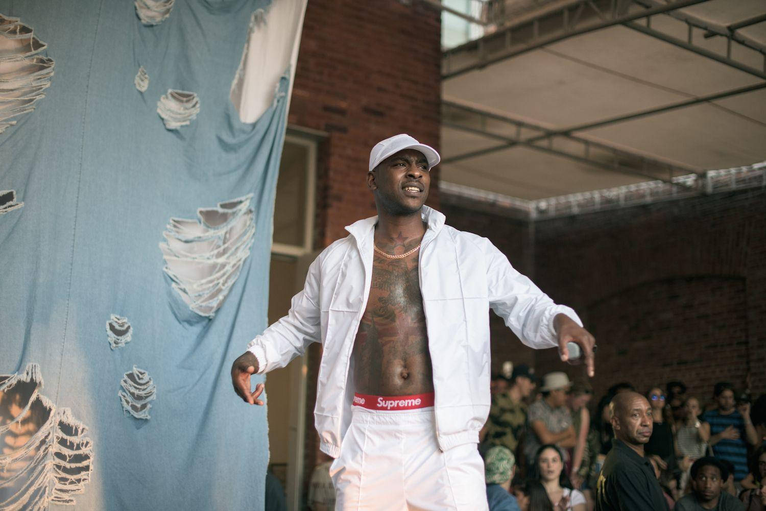 Skepta Wearing A White Jacket Wallpaper