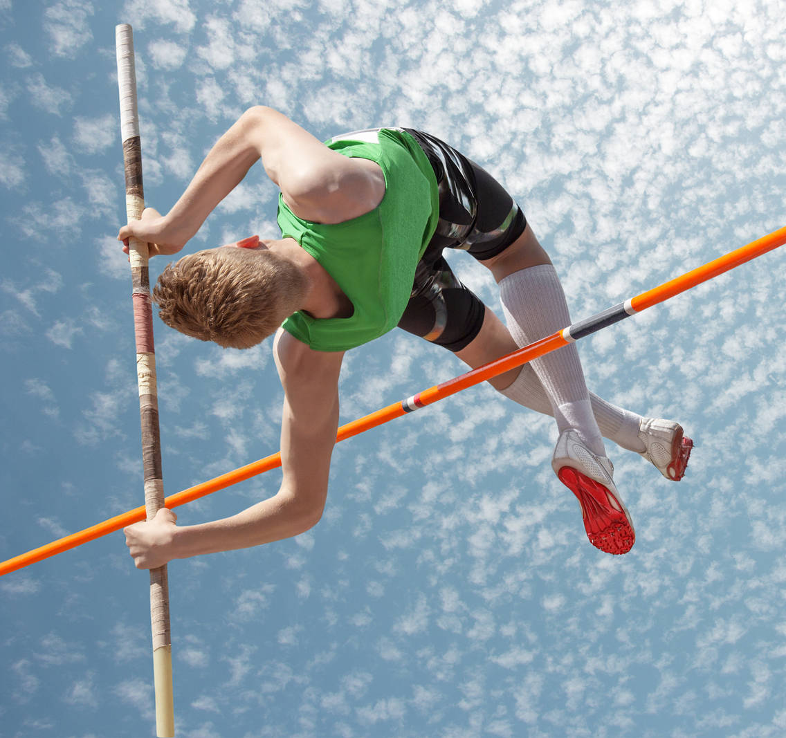 Skilled Male Pole Vault Athlete Wallpaper