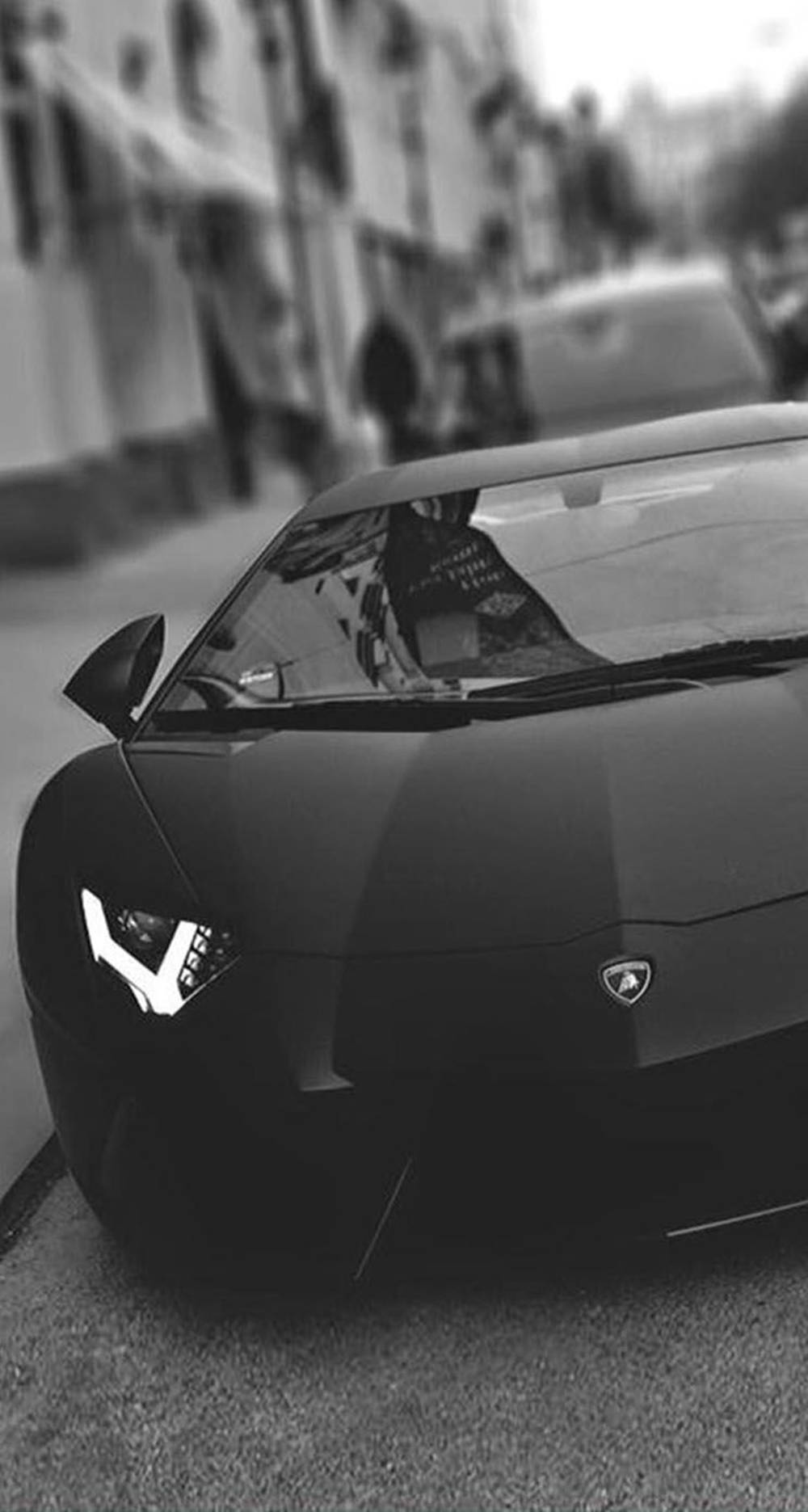 Sleek Lamborghini Iphone Case On Sidewalk Wallpaper