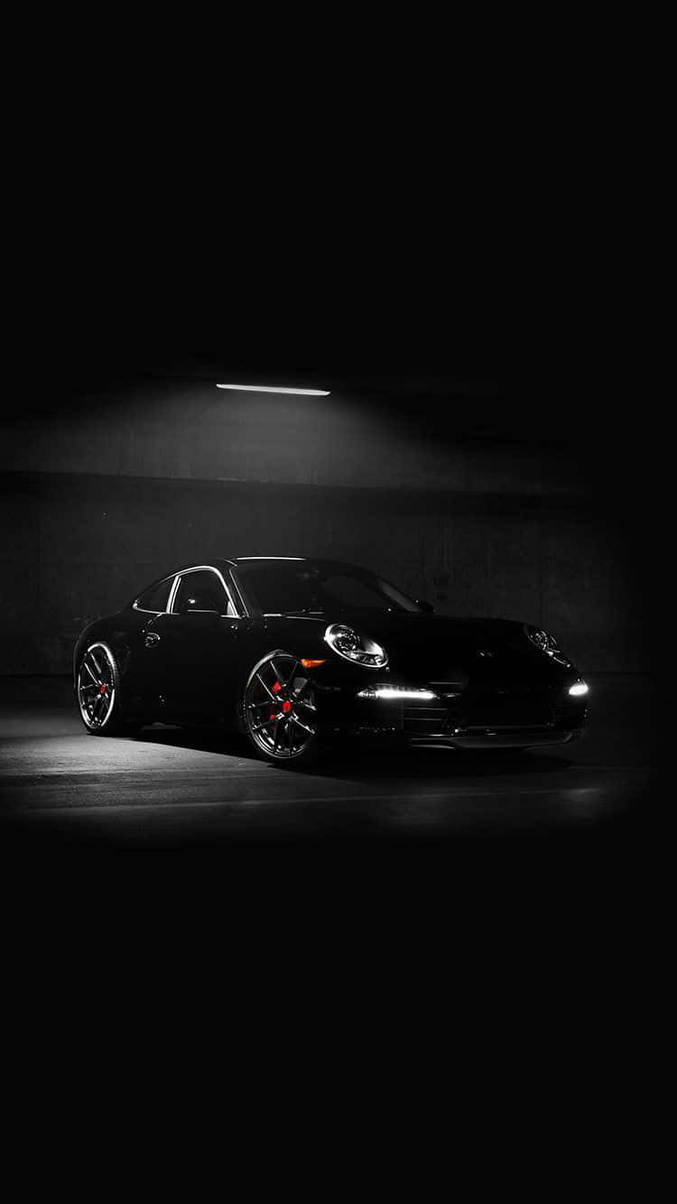 Sleek Porsche Sports Car On A Scenic Road With Iphone-display Optimization Wallpaper