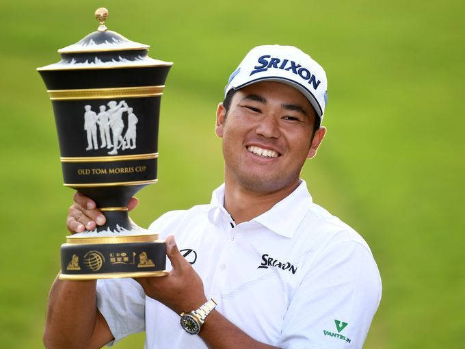 Smiling Hideki Matsuyama Holding Trophy Wallpaper