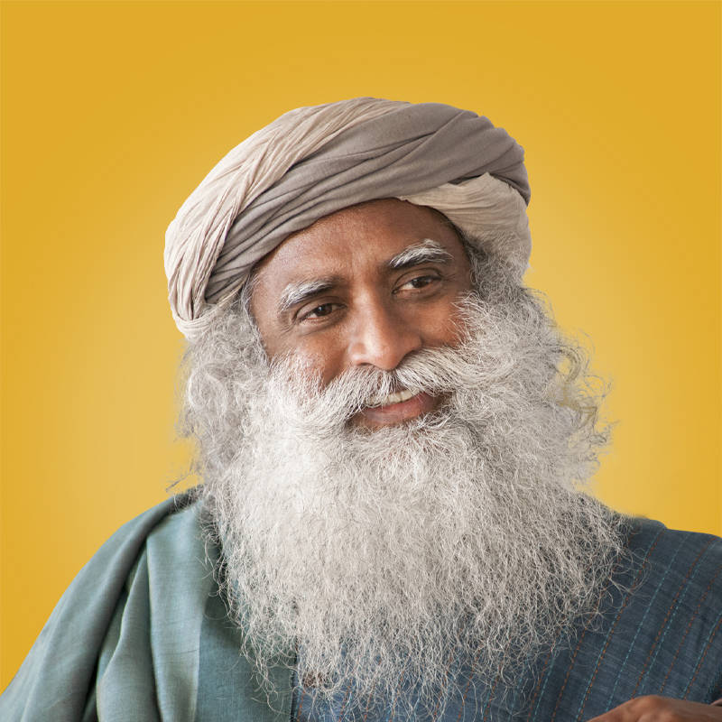 Smiling Sadhguru Against A Yellow Background Wallpaper