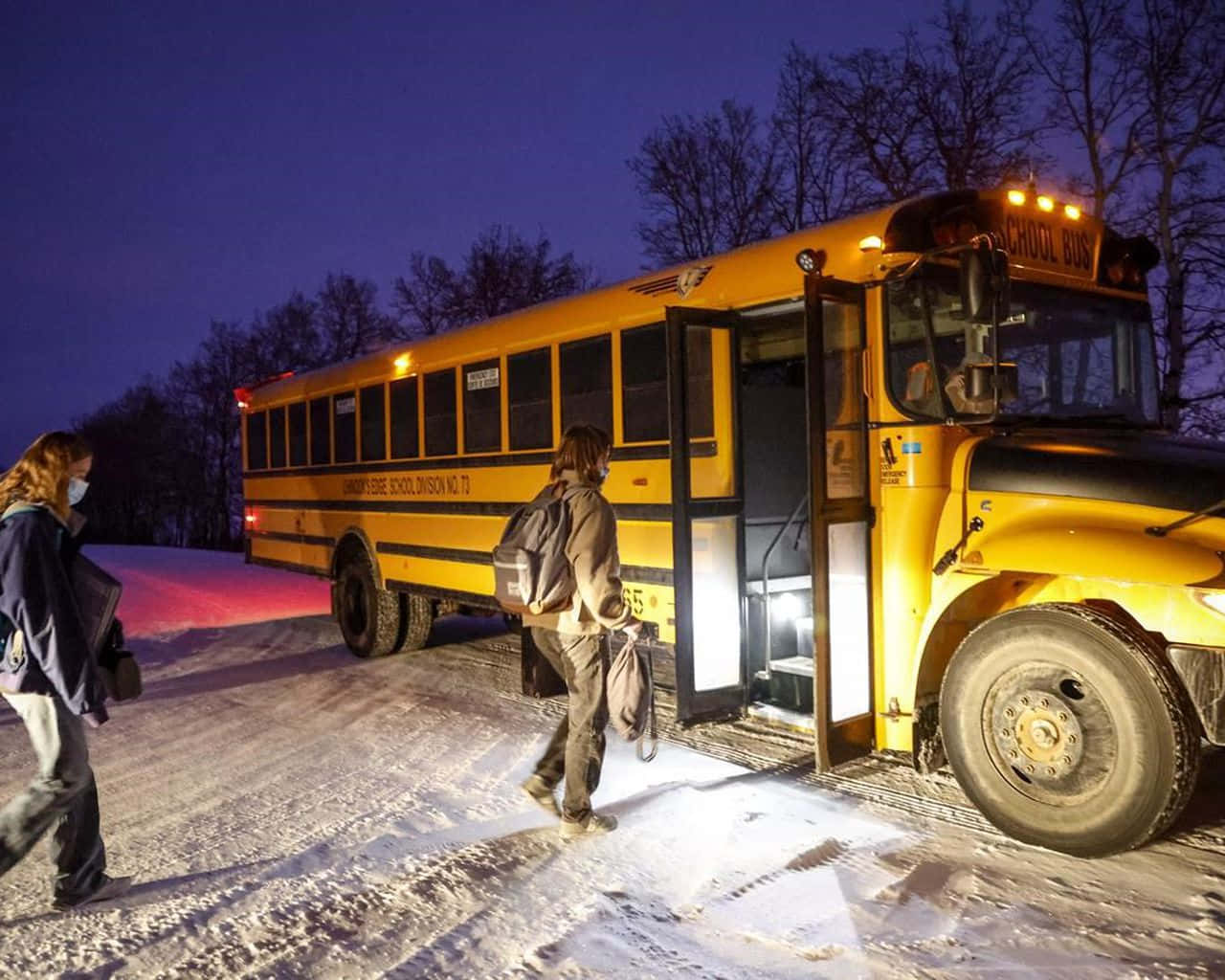 Snow-covered School Bus At A Winter Stop Wallpaper