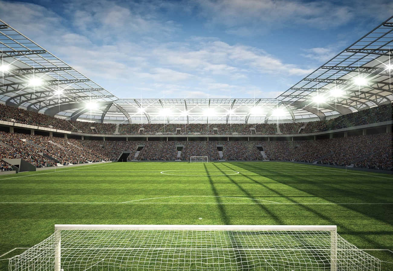 Soccer Fans Show Their Passion For Their Favorite Teams At A Crowded Soccer Stadium Wallpaper