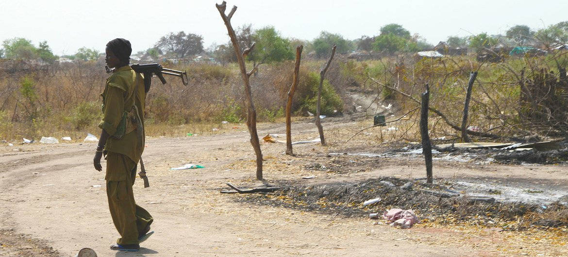 South Sudan Soldier Holds Gun Wallpaper