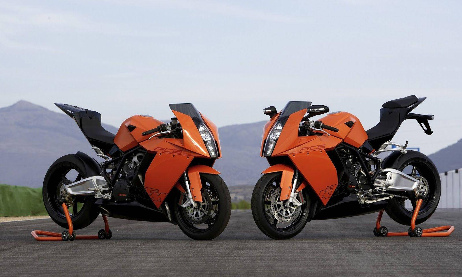 Spectacular Pair Of Orange And Black Ktm Bikes Wallpaper