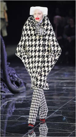 Striking Presentation Of Alexander Mcqueen's Checkered Outfit From His Latest Collection Wallpaper