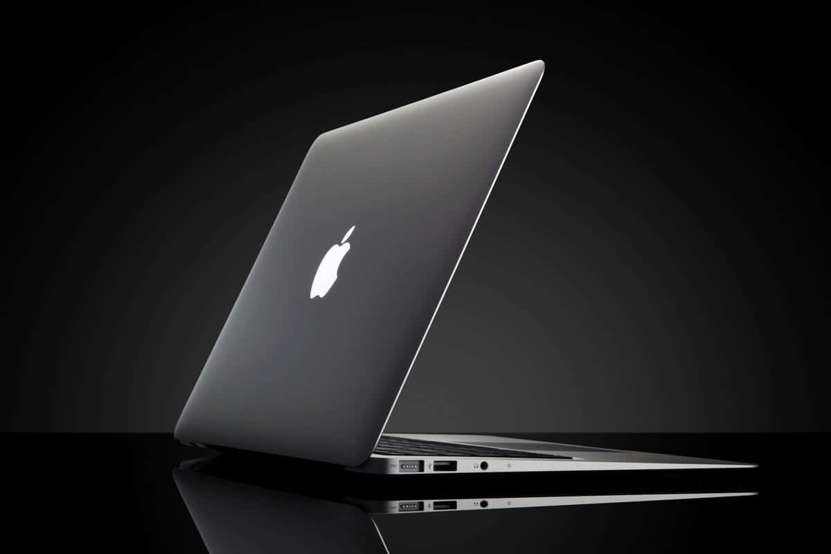 Stylish Black Macbook Laptop Wallpaper