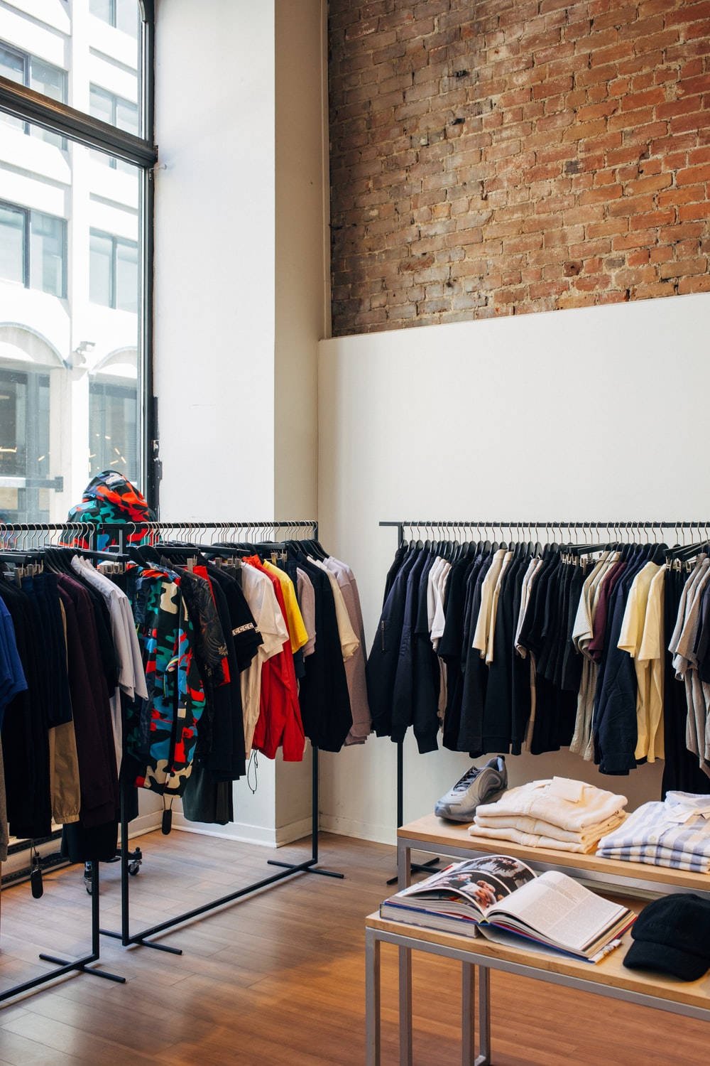 Stylish Clothing Store With Brick Wall Wallpaper