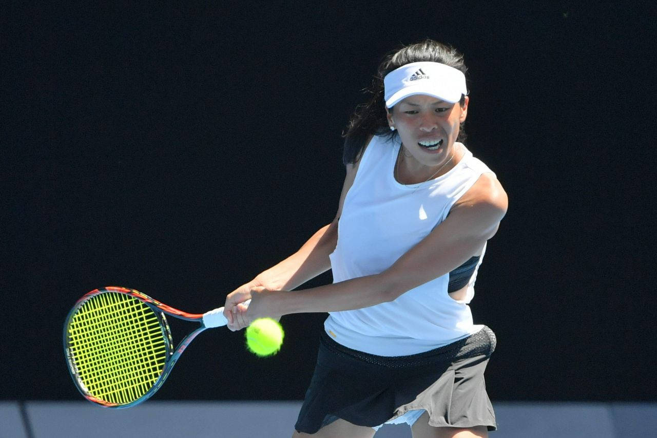 Su-wei Hsieh Showcasing Her Precision Before Hitting A Tennis Ball Wallpaper