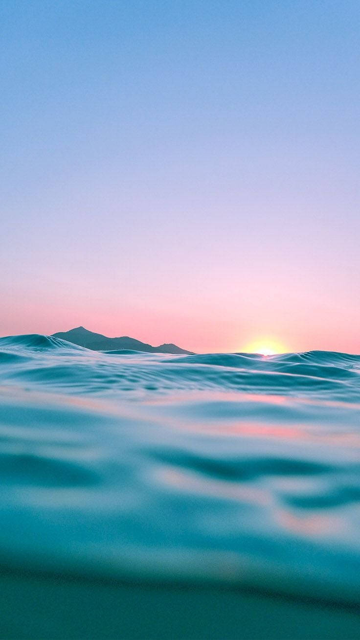 Sunset Iphone Display Of Ocean Wallpaper