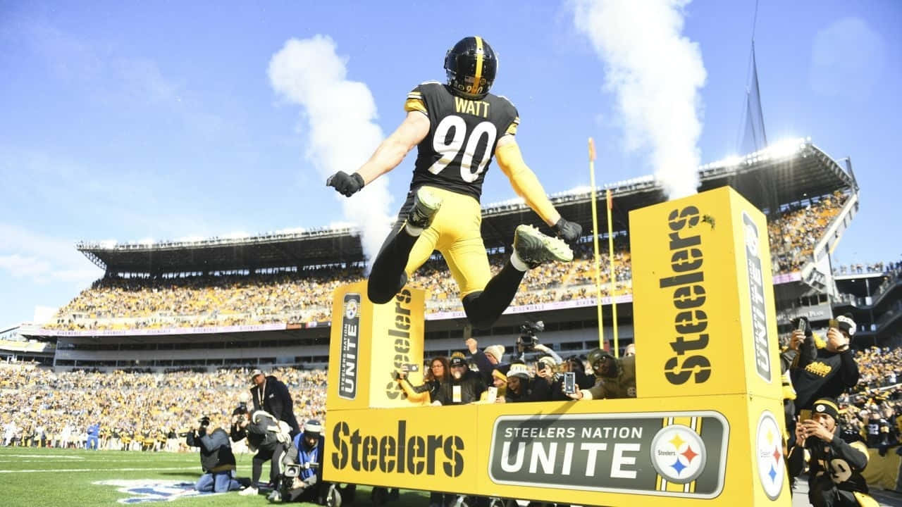 T.j. Watt Back View Jump Shot Wallpaper