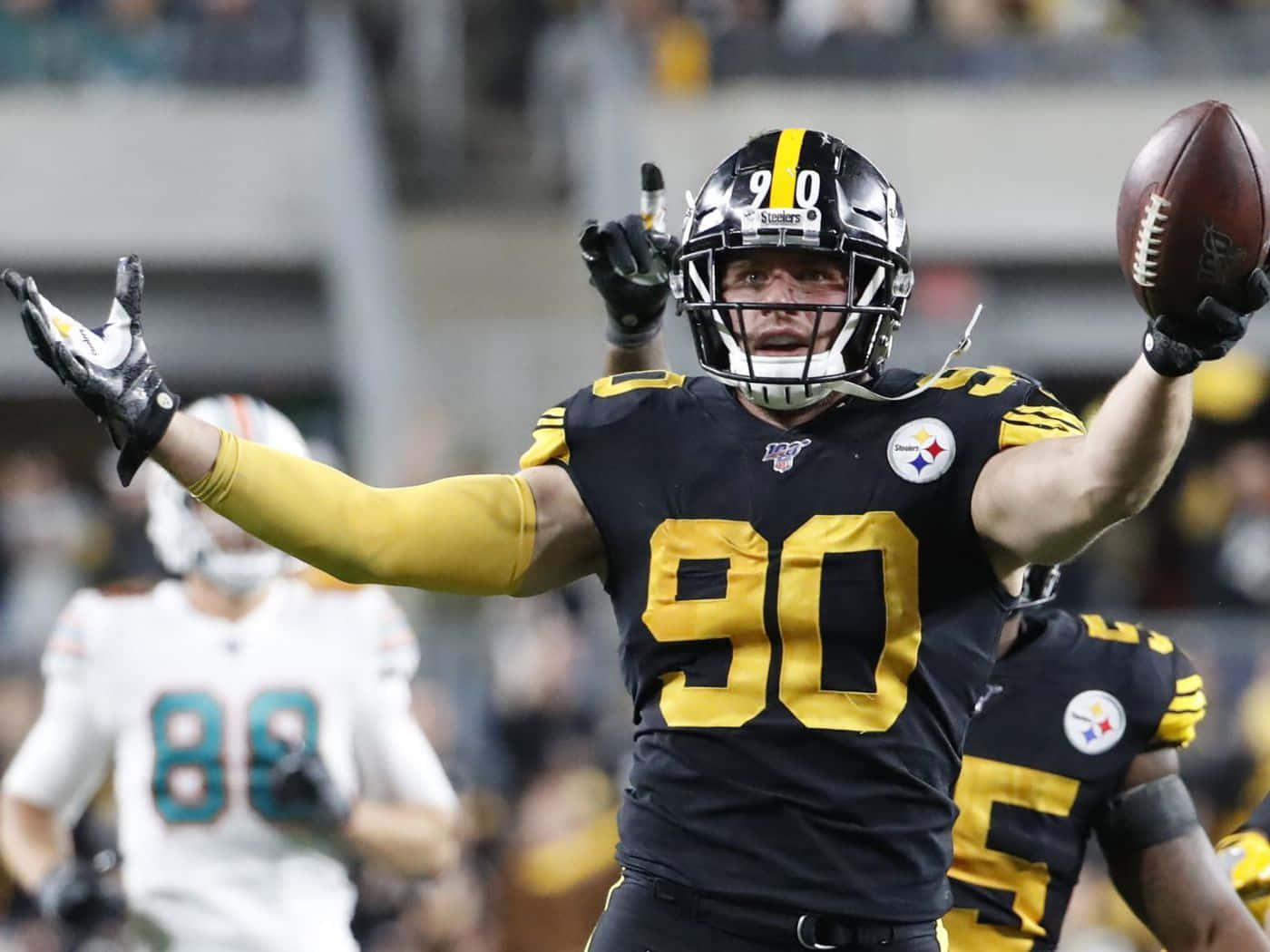 T.j. Watt Yellow-black Football Uniform Wallpaper