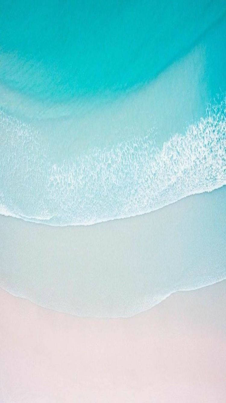 Take In The Serenity Of A Sandy Beach With The New Iphone 11 Wallpaper