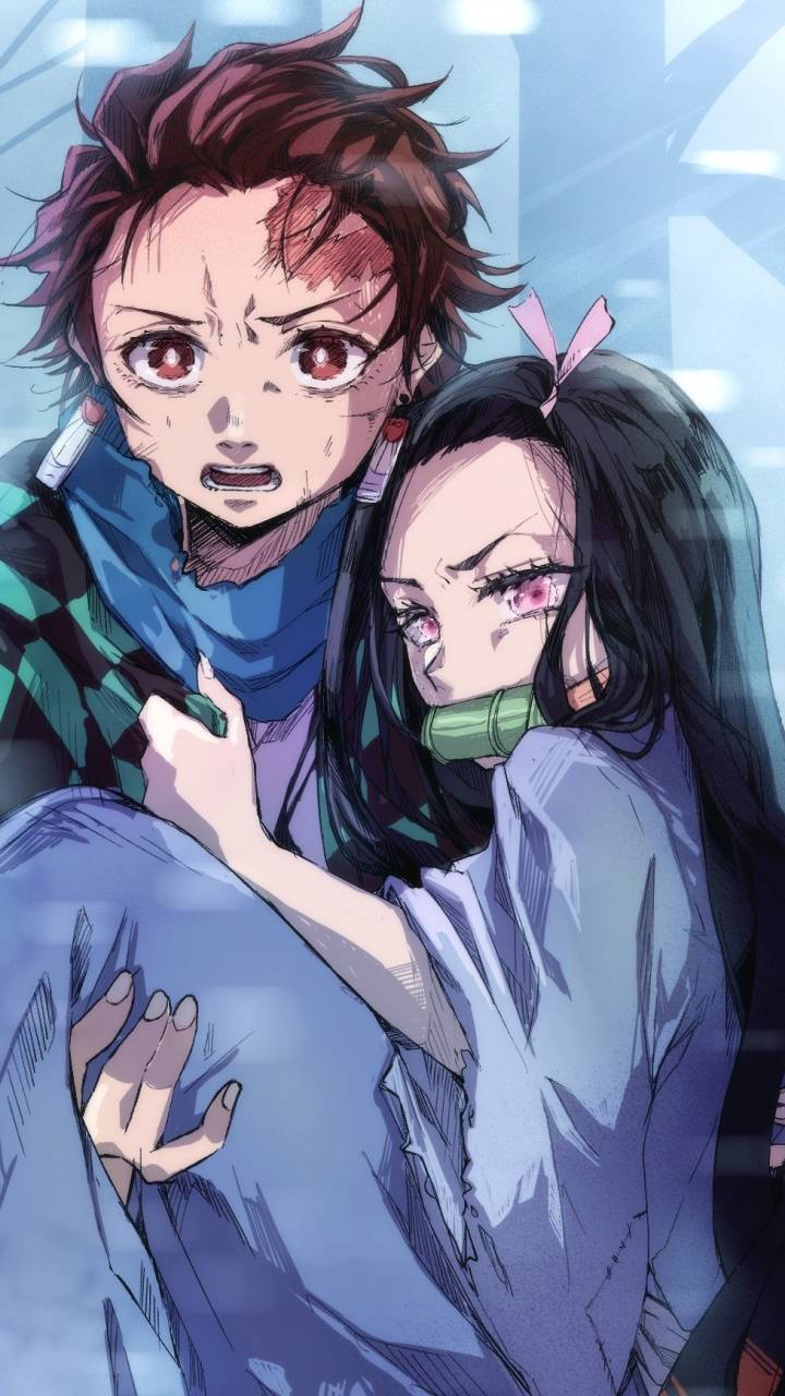 Tanjiro Embraces A Crying Nezuko Wallpaper