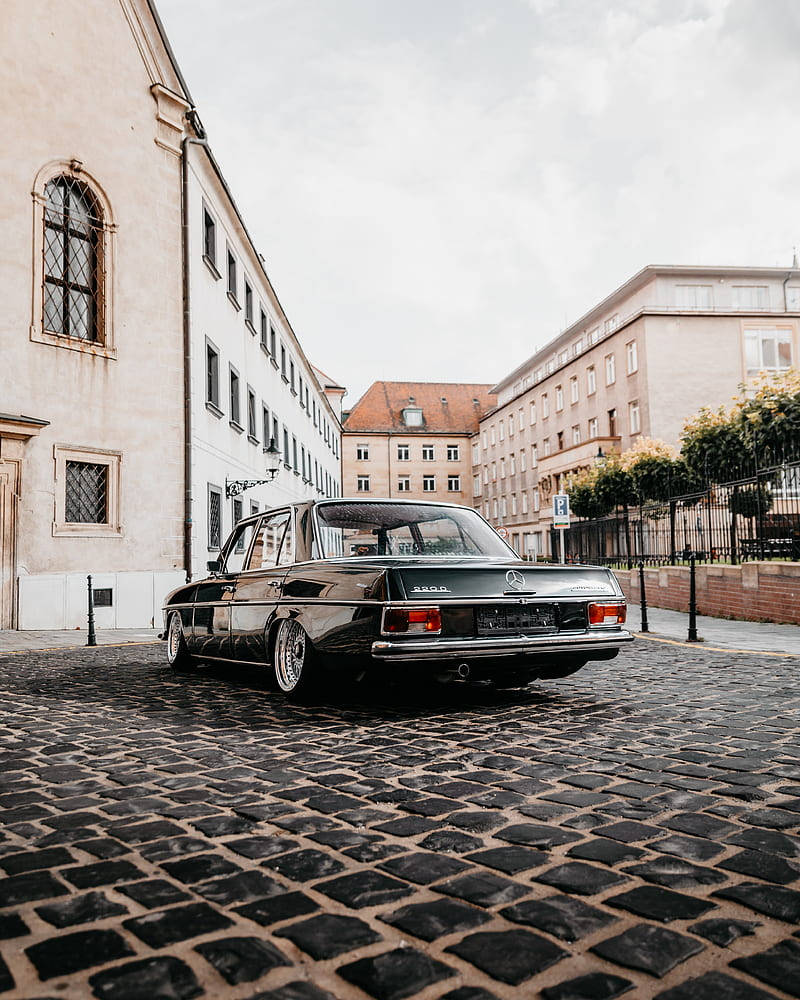 The Exquisitely Powerful Black Mercedes-benz W114 Wallpaper