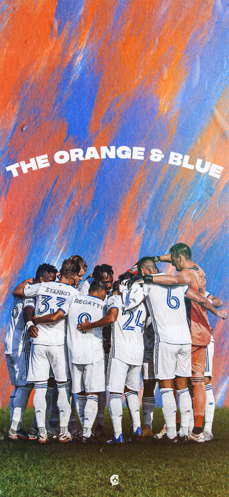 The Fc Cincinnati Soccer Players Making A Plan Wallpaper