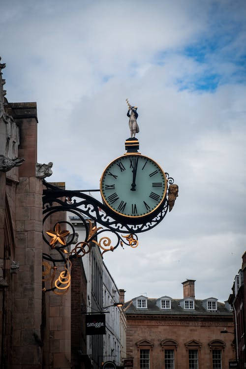 The Iconic York Minster Soaring Into The Sky Above The Charming Streets Of Historic York, Uk Wallpaper