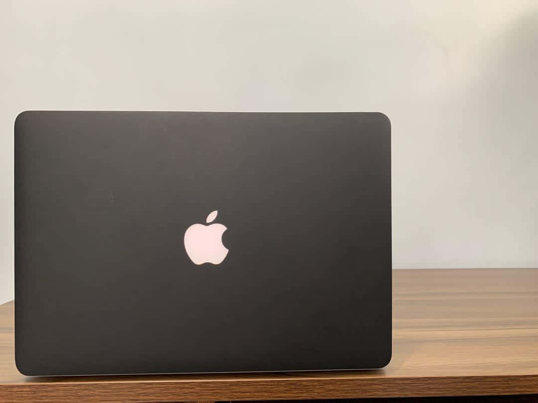 The Latest Black Macbook For More Efficient Computing Wallpaper