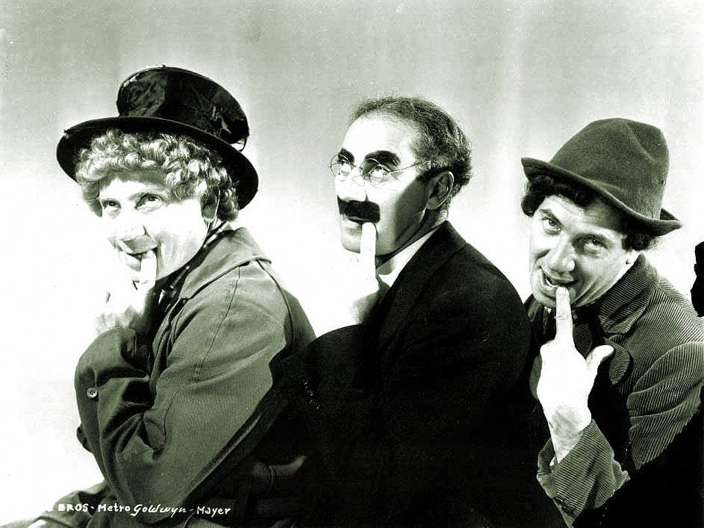 The Marx Brothers In A Playful Moment Wallpaper