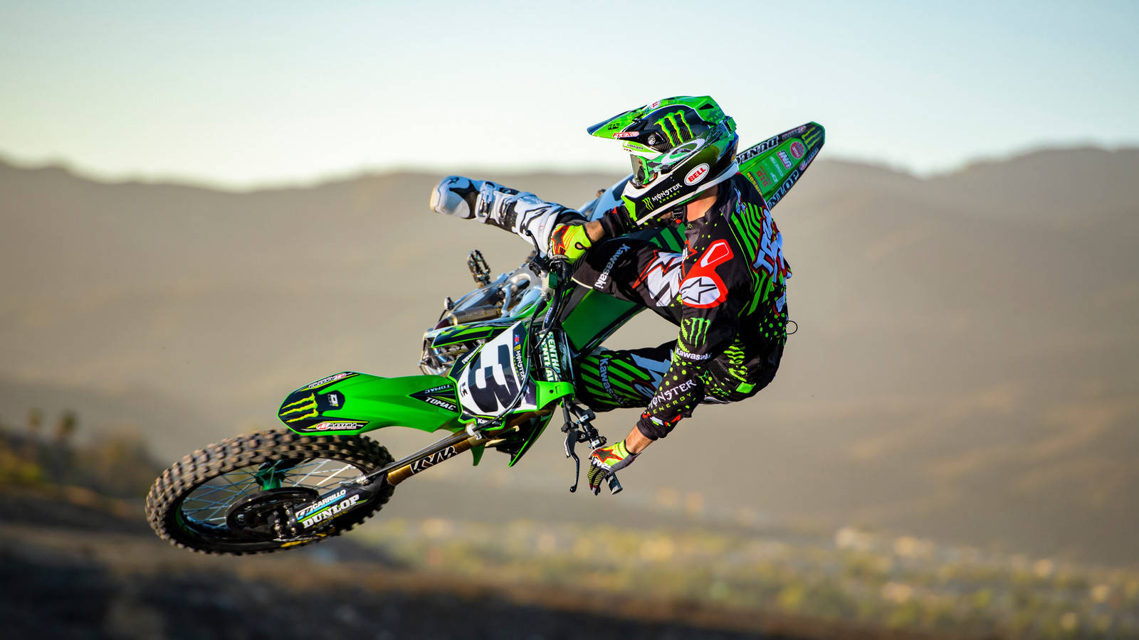 Thrilling Action With A Monster Dirt Bike Wallpaper